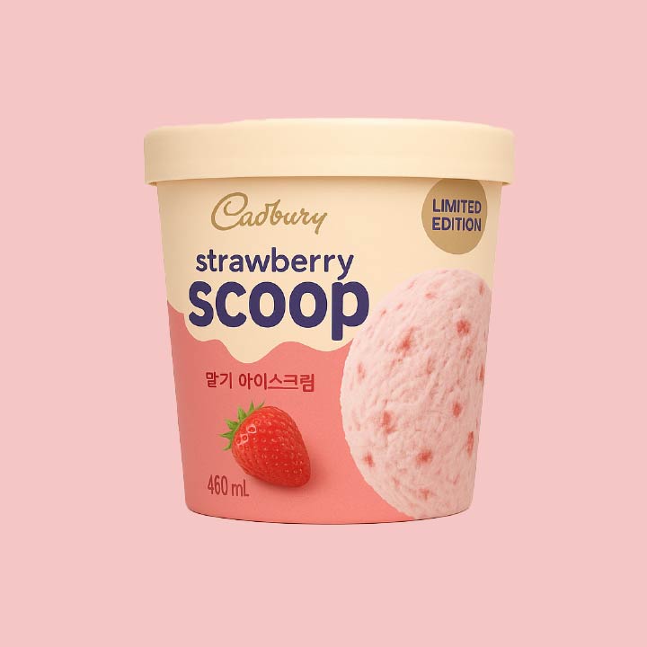 Cadbury limited-edition strawberry ice cream pint with strawberry graphics on a pink container.